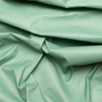 Tejido impermeable hidrófugo cire con recubrimiento de poliéster